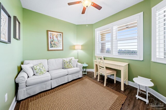 612 Lost Key Dr Unit 702-B, Pensacola, FL 32507 - living room featuring a ceiling fan, dark wood-style flooring, and baseboards