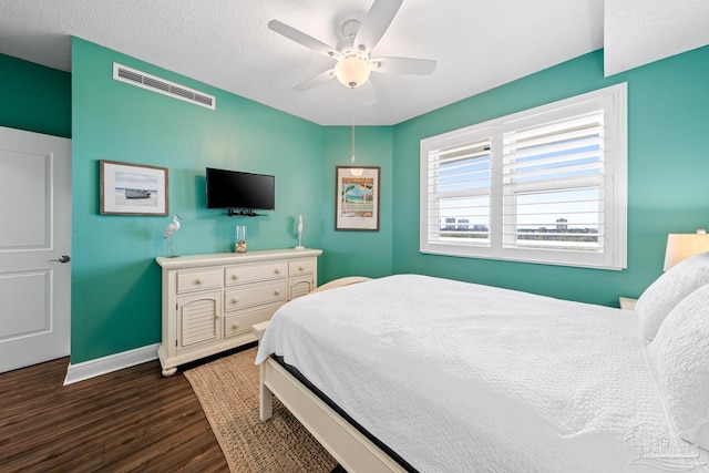 612 Lost Key Dr Unit 702-B, Pensacola, FL 32507 - bedroom featuring wood finished floors, baseboards, and a ceiling fan