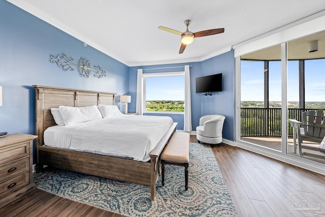 612 Lost Key Dr Unit 702-B, Pensacola, FL 32507 - bedroom featuring access to outside, crown molding, dark wood-type flooring, ceiling fan, and baseboards