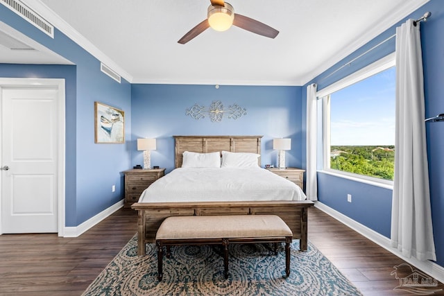 612 Lost Key Dr Unit 702-B, Pensacola, FL 32507 - bedroom featuring baseboards, dark wood finished floors, a ceiling fan, and crown molding