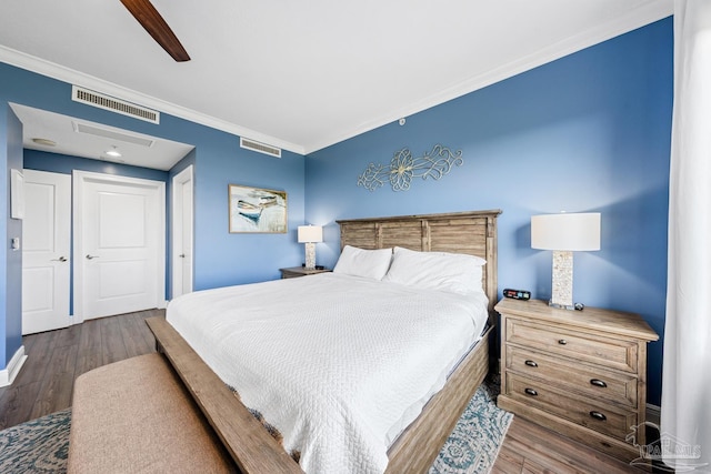 612 Lost Key Dr Unit 702-B, Pensacola, FL 32507 - bedroom with crown molding, dark wood-style flooring, and a ceiling fan