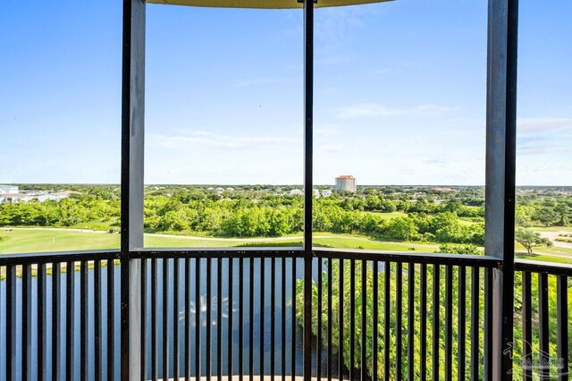 612 Lost Key Dr Unit 702-B, Pensacola, FL 32507 - unfurnished sunroom featuring golf course view and view of scattered trees