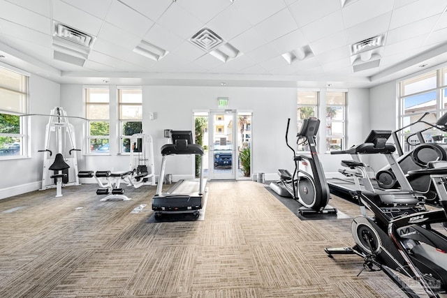612 Lost Key Dr Unit 702-B, Pensacola, FL 32507 - gym featuring baseboards, carpet flooring, healthy amount of natural light, and a drop ceiling
