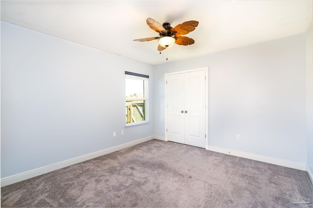 unfurnished room with carpet, baseboards, and ceiling fan