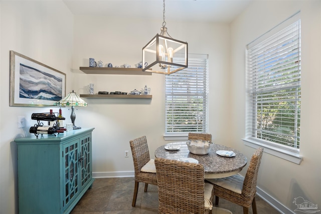 1430 Regency Rd Unit H103, Gulf Shores, AL 36542 - dining space with a chandelier and healthy amount of natural light