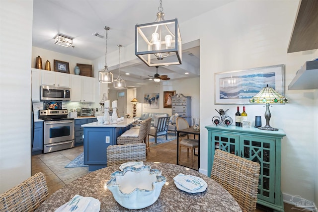 1430 Regency Rd Unit H103, Gulf Shores, AL 36542 - dining area featuring ceiling fan and light tile patterned flooring
