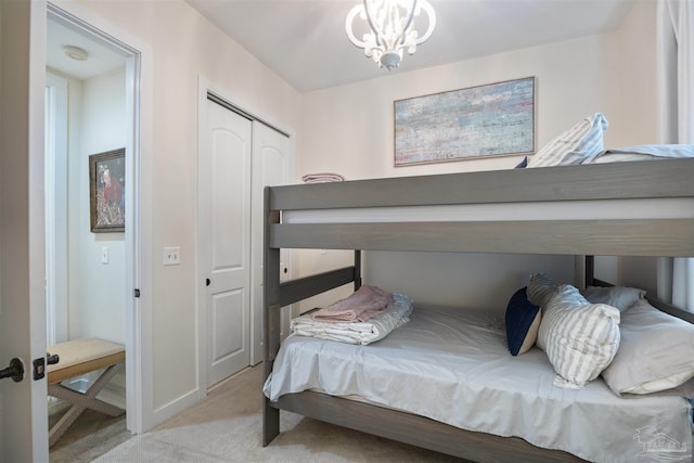 1430 Regency Rd Unit H103, Gulf Shores, AL 36542 - carpeted bedroom with a chandelier and a closet