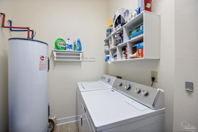 1430 Regency Rd Unit H103, Gulf Shores, AL 36542 - laundry area with water heater and washing machine and clothes dryer