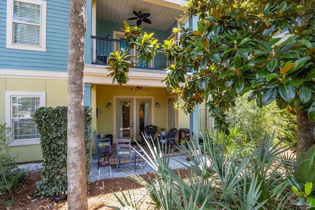 1430 Regency Rd Unit H103, Gulf Shores, AL 36542 - doorway to property with french doors, ceiling fan, a balcony, and stucco siding