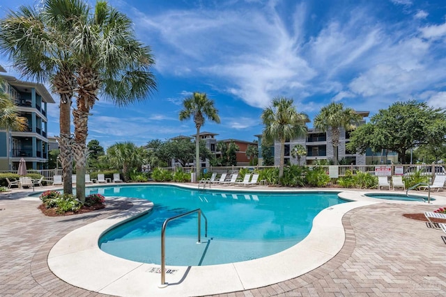 1430 Regency Rd Unit H103, Gulf Shores, AL 36542 - community pool featuring a hot tub and a patio