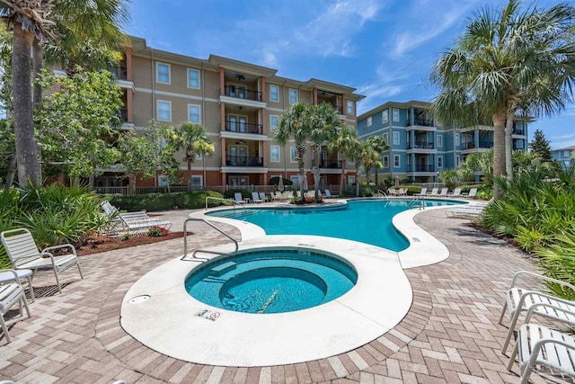 1430 Regency Rd Unit H103, Gulf Shores, AL 36542 - community pool with a hot tub and a patio area