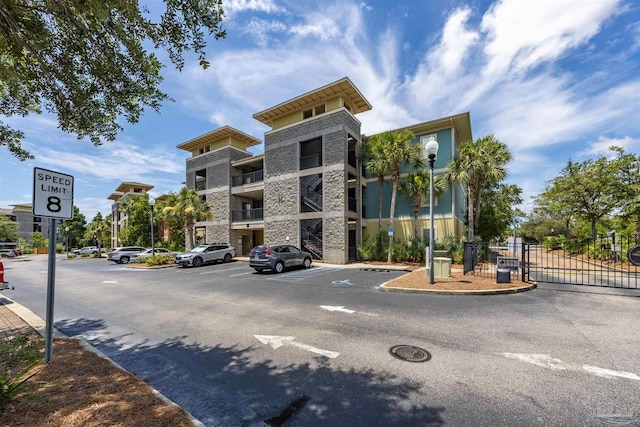 1430 Regency Rd Unit H103, Gulf Shores, AL 36542 - view of property featuring uncovered parking
