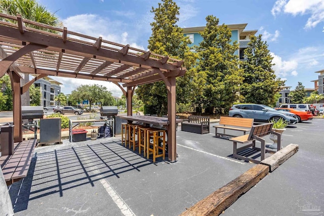 1430 Regency Rd Unit H103, Gulf Shores, AL 36542 - view of patio / terrace with a pergola and grilling area