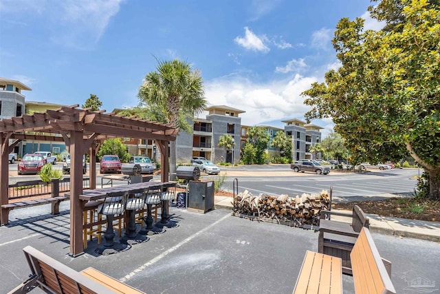 1430 Regency Rd Unit H103, Gulf Shores, AL 36542 - view of patio / terrace with a pergola and outdoor dining space