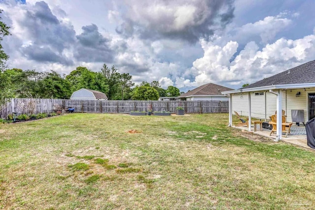 view of yard featuring a patio area and a fenced backyard