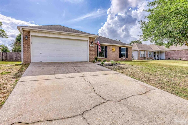 ranch-style house featuring concrete driveway, a front yard, brick siding, and a garage