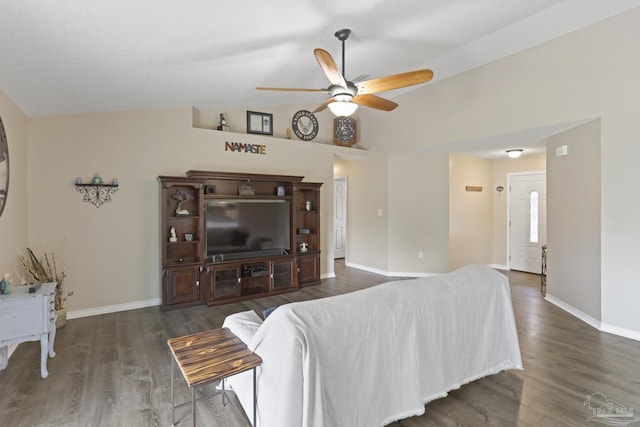 living area with ceiling fan, lofted ceiling, baseboards, and wood finished floors