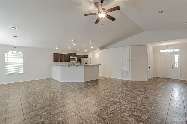 unfurnished living room with vaulted ceiling and ceiling fan