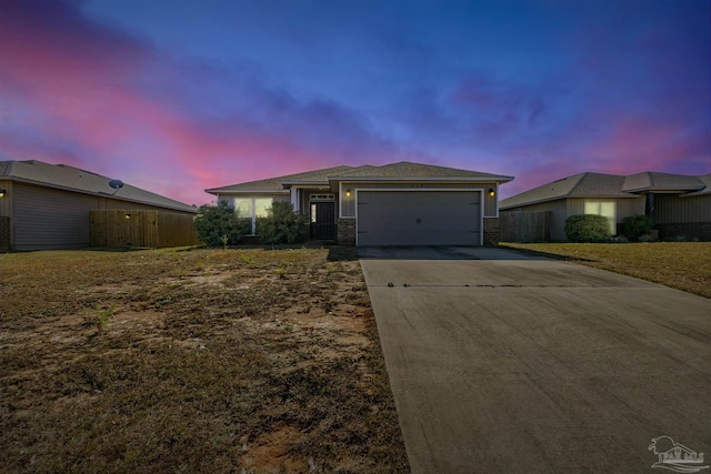 ranch-style house featuring a garage