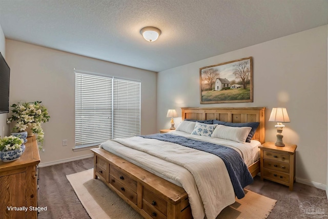 carpeted bedroom with a textured ceiling