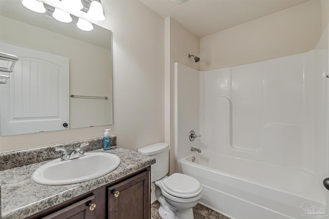 full bathroom featuring vanity, toilet, and washtub / shower combination