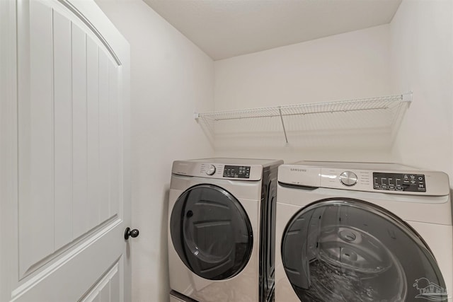 laundry area with washer and clothes dryer