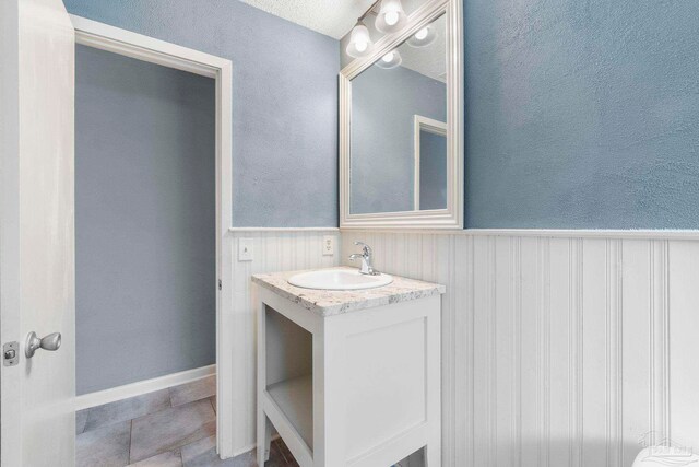 bathroom featuring tile patterned flooring and vanity