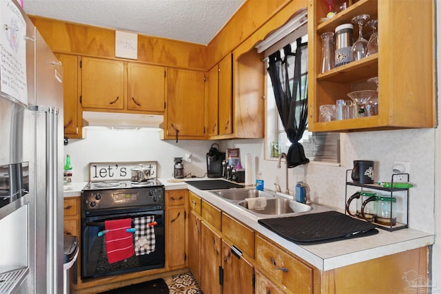 kitchen with high end fridge, a sink, range with electric stovetop, light countertops, and under cabinet range hood