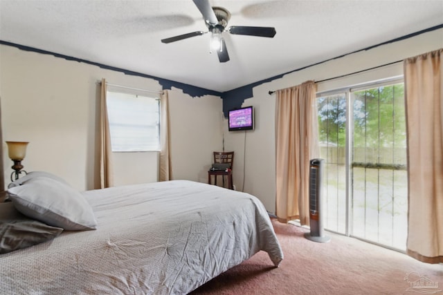 bedroom with carpet floors, access to exterior, and ceiling fan