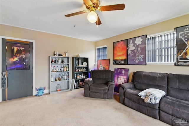 carpeted living room featuring ceiling fan