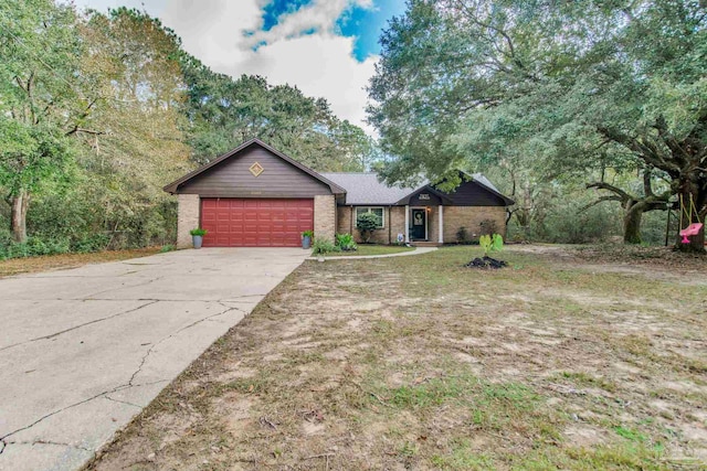 single story home featuring a garage