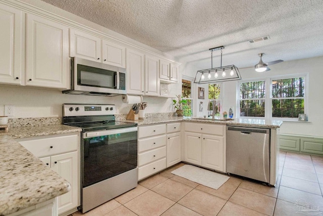 kitchen with white cabinetry, sink, and appliances with stainless steel finishes