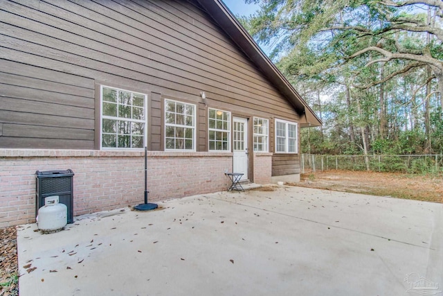 view of side of home featuring a patio