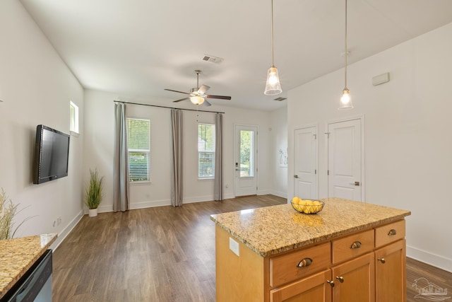 kitchen with dishwasher, dark wood-style flooring, a ceiling fan, baseboards, and pendant lighting