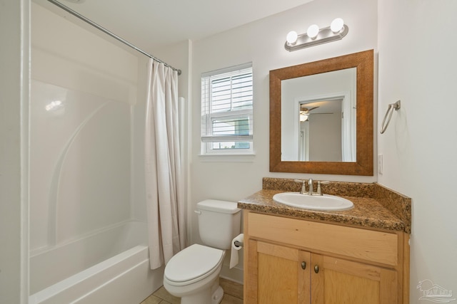 bathroom featuring toilet, shower / bath combination with curtain, and vanity