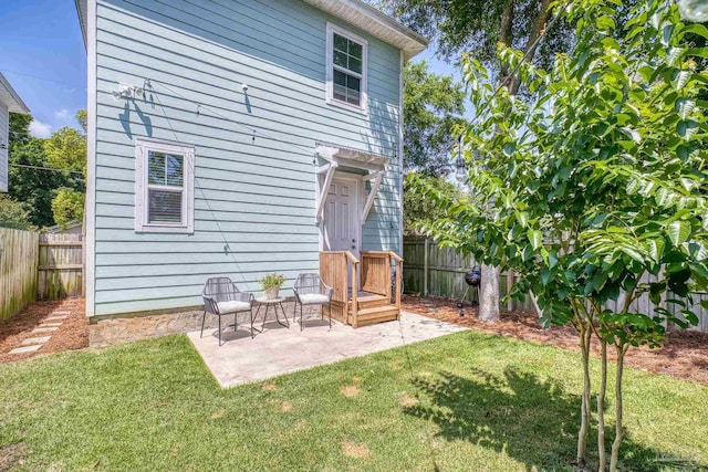 back of property with a patio