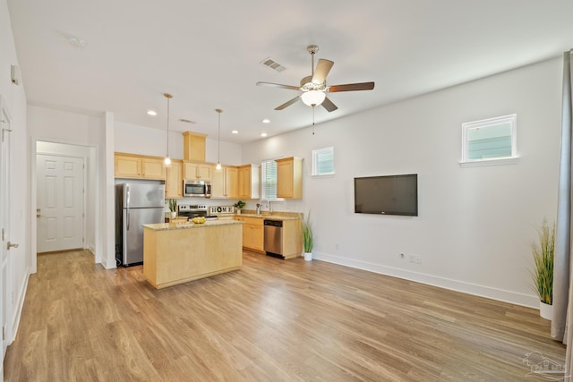 kitchen with stainless steel appliances, light brown cabinetry, ceiling fan, light wood-style flooring, and recessed lighting