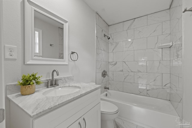 bathroom with vanity, toilet, marble finish floor, and shower / bath combination