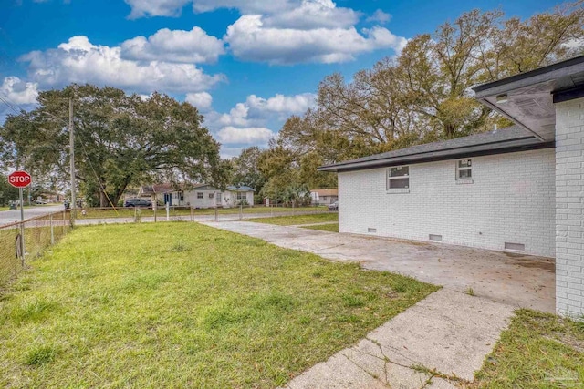 view of yard with fence