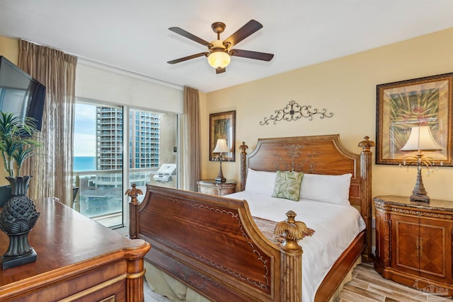 bedroom featuring ceiling fan, access to outside, and light wood-type flooring