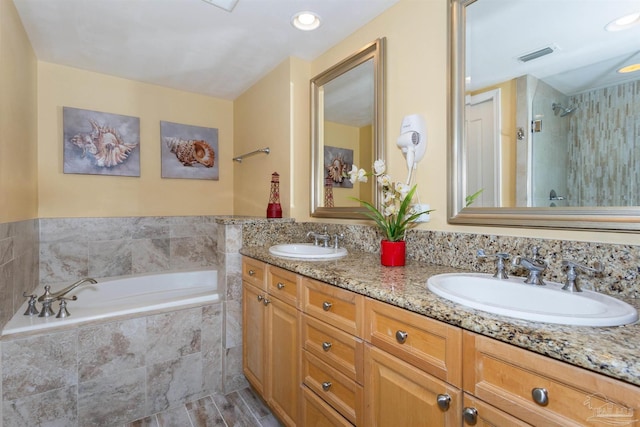 bathroom featuring vanity, wood-type flooring, and plus walk in shower