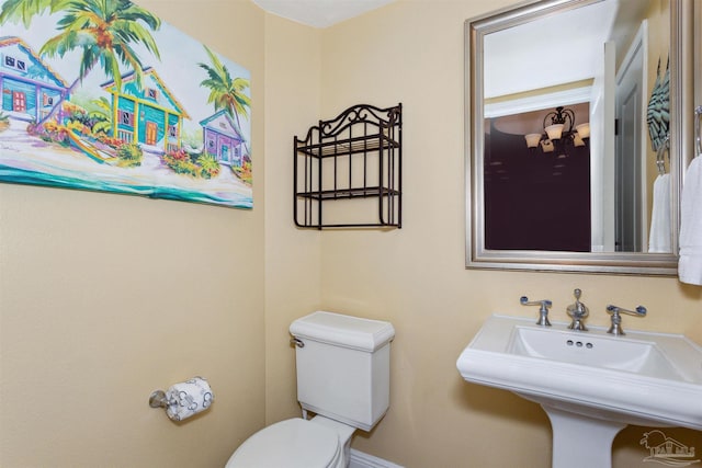 bathroom featuring sink and toilet