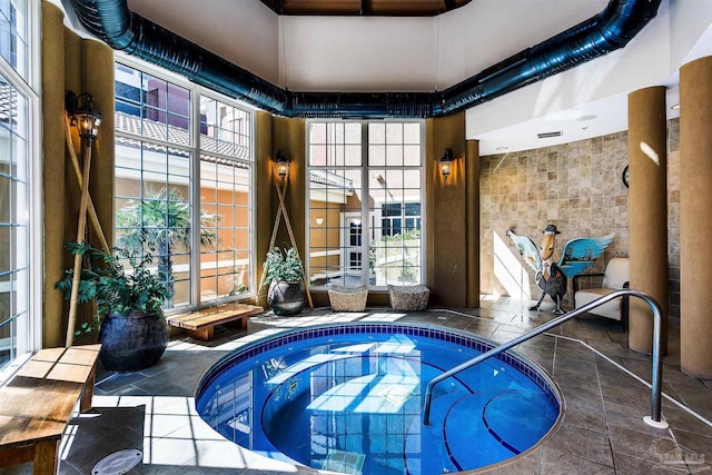 view of pool featuring an indoor hot tub