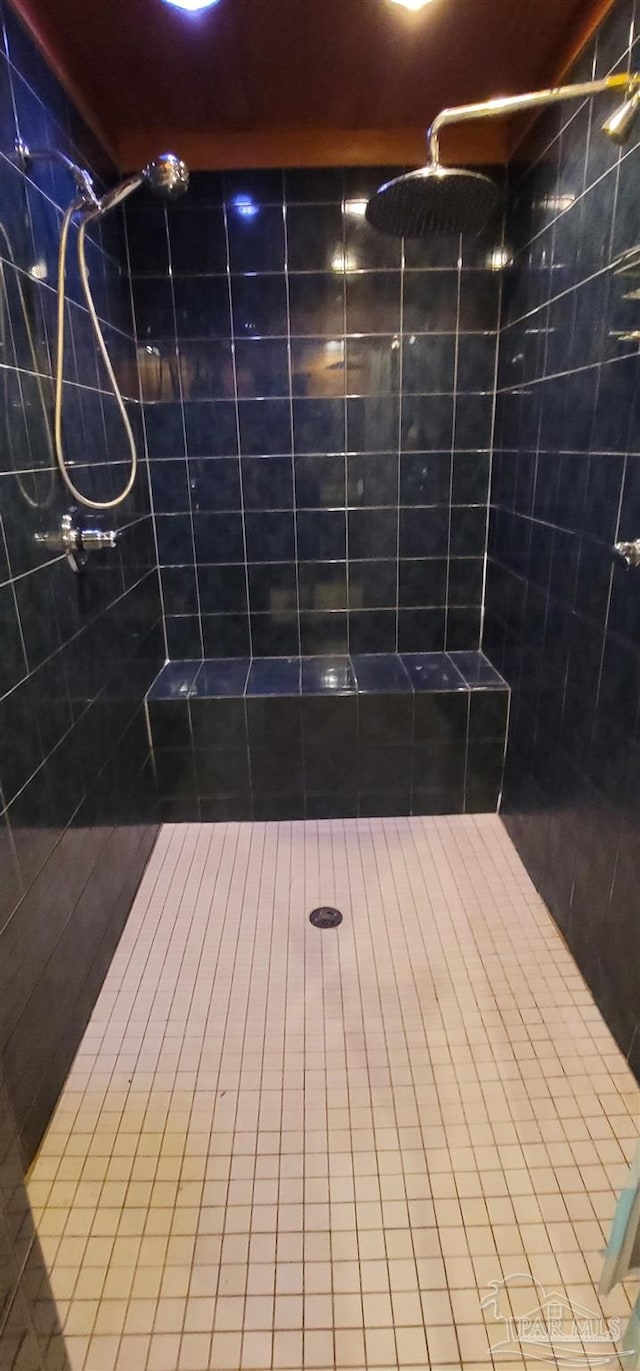 bathroom with a tile shower