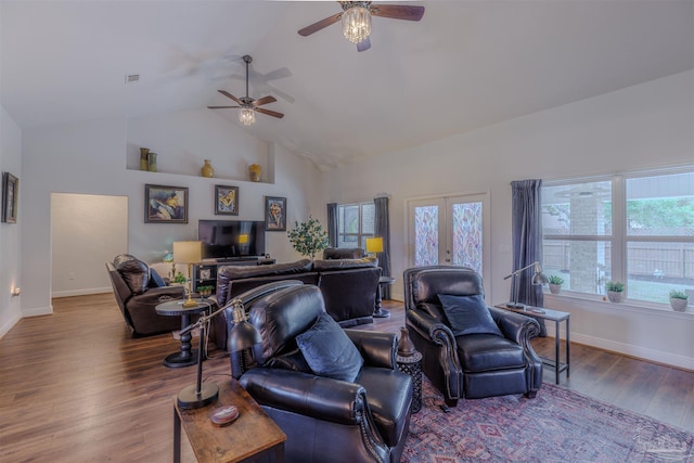 living room with high vaulted ceiling, ceiling fan, baseboards, and wood finished floors