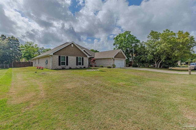 ranch-style home featuring aphalt driveway, a garage, brick siding, fence, and a front lawn