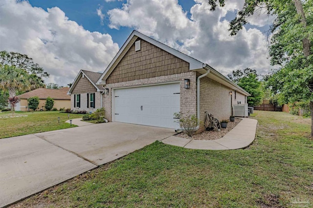 view of front of home featuring a garage, concrete driveway, brick siding, and a front yard