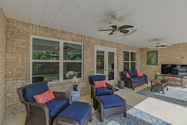 view of patio / terrace with an outdoor living space, ceiling fan, and french doors