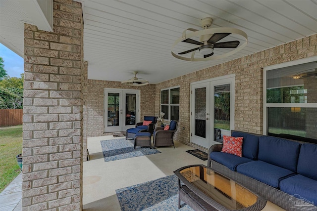 view of patio featuring french doors, a ceiling fan, and an outdoor living space
