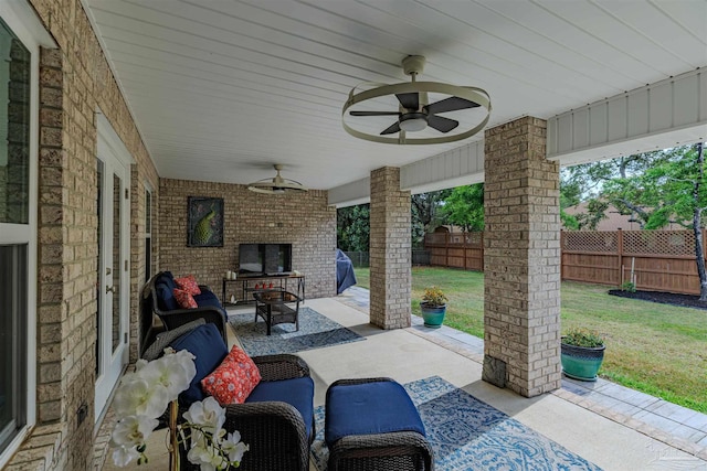 view of patio with a fenced backyard, an outdoor hangout area, and ceiling fan